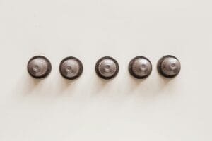 set of capsules for espresso machine on white background
