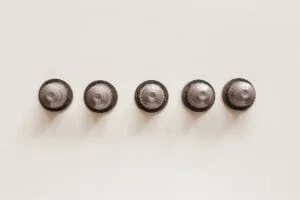 set of capsules for espresso machine on white background