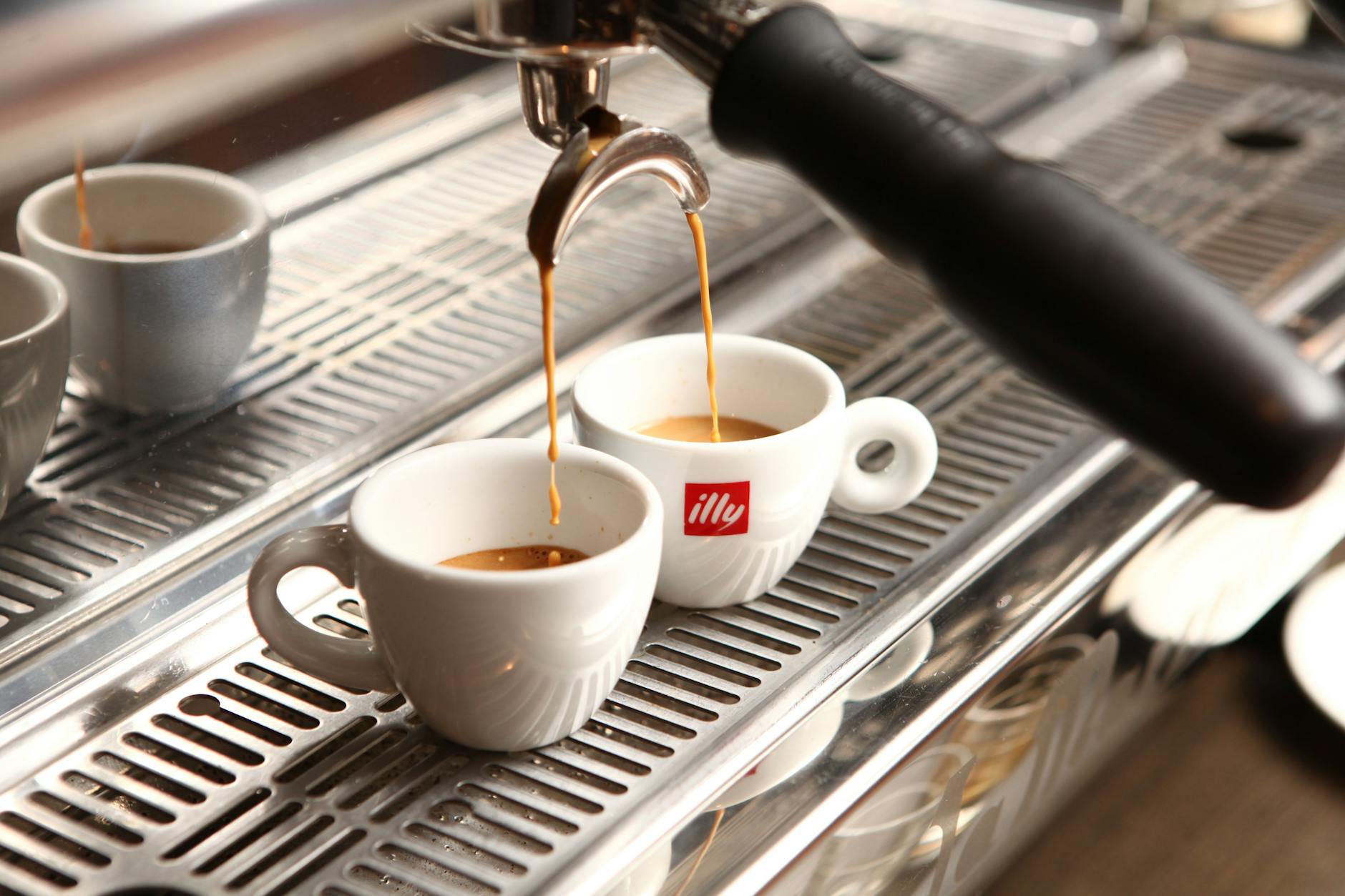 two teacups on machine