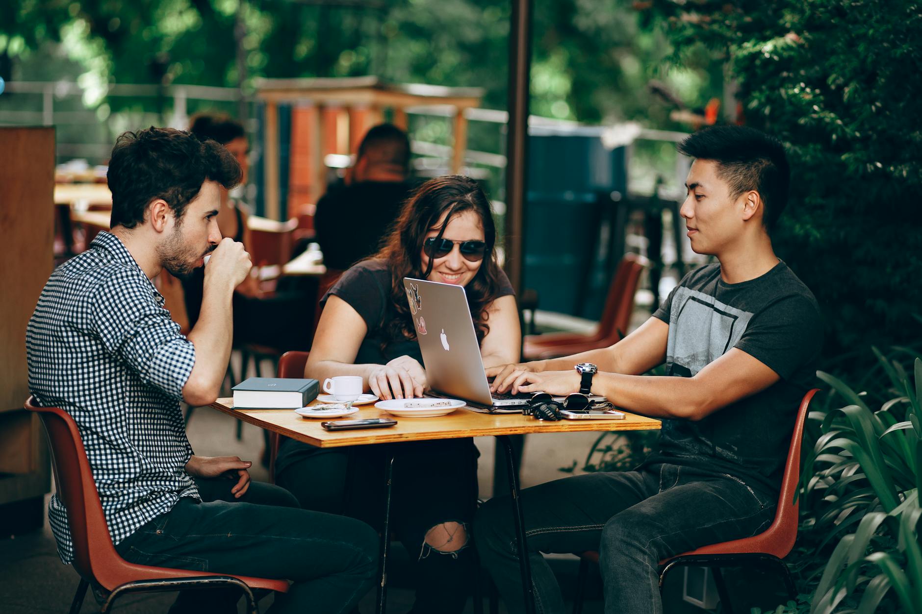 group of friends hanging out drinking coffee in a cafe. national coffee day