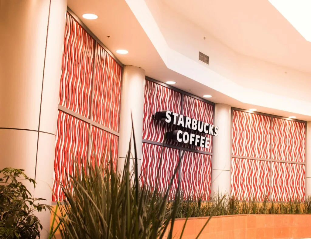 Stylish interior design of a Starbucks sustainability - example coffee shop in Mexico City with vibrant wall patterns.